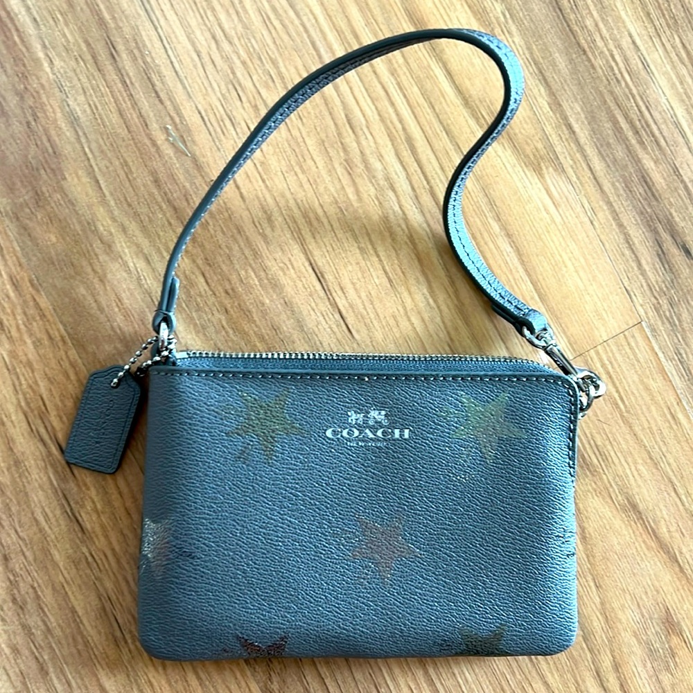 Coach wristlet never used with stars!